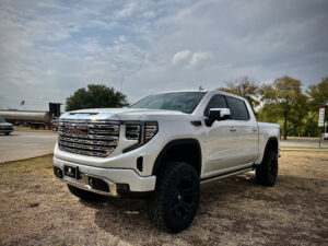 Overall view of the comprehensively upgraded 2023 GMC Denali 1500 by Truxx Outfitters, encapsulating transformative elegance and unmatched off-road prowess.