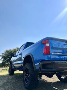  Back shot illustrating the impressive elevation and robust stance of the 2023 Chevy 1500 ZR2, achieved through the meticulous integration of the BDS 4" Lift System.
