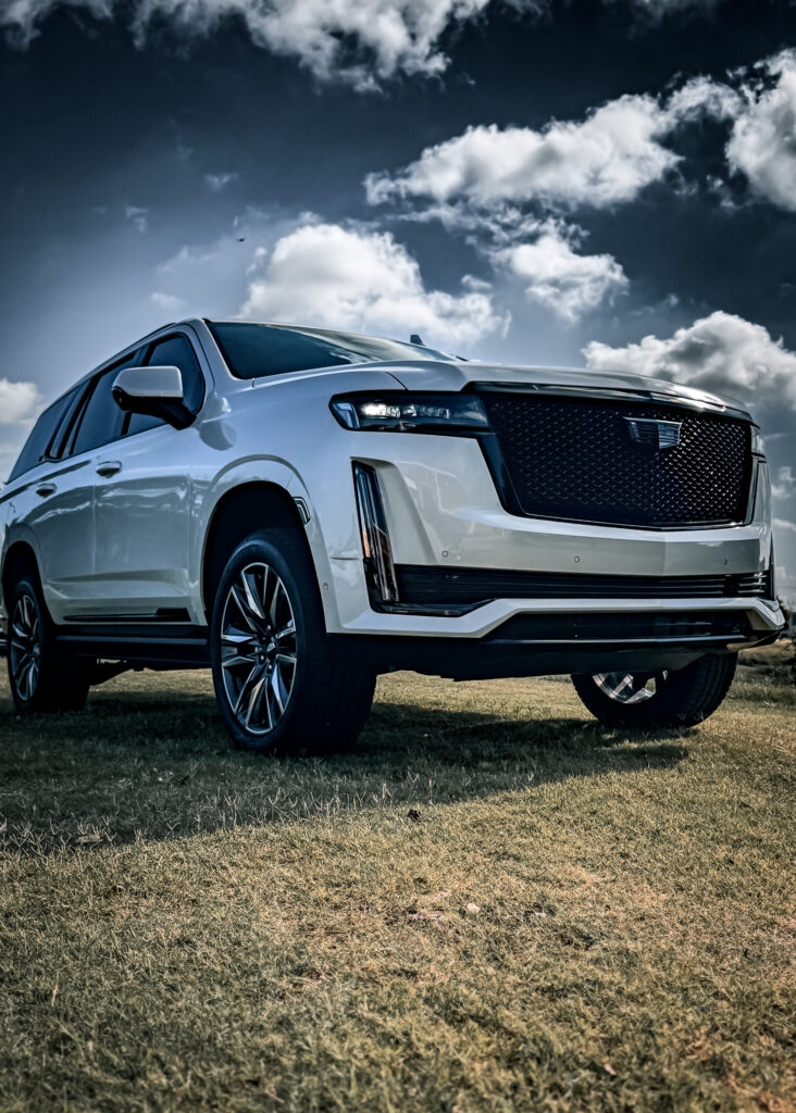 Front view of the 2024 Cadillac Escalade featuring a blacked-out grille and headlight trim, part of the TRUXX Outfitters chrome delete service