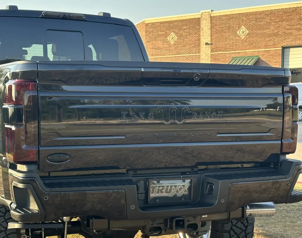 A full chrome delete and smoked tail lights enhance its aggressive look for this 2024 Ford F-250 Super Duty King Ranch