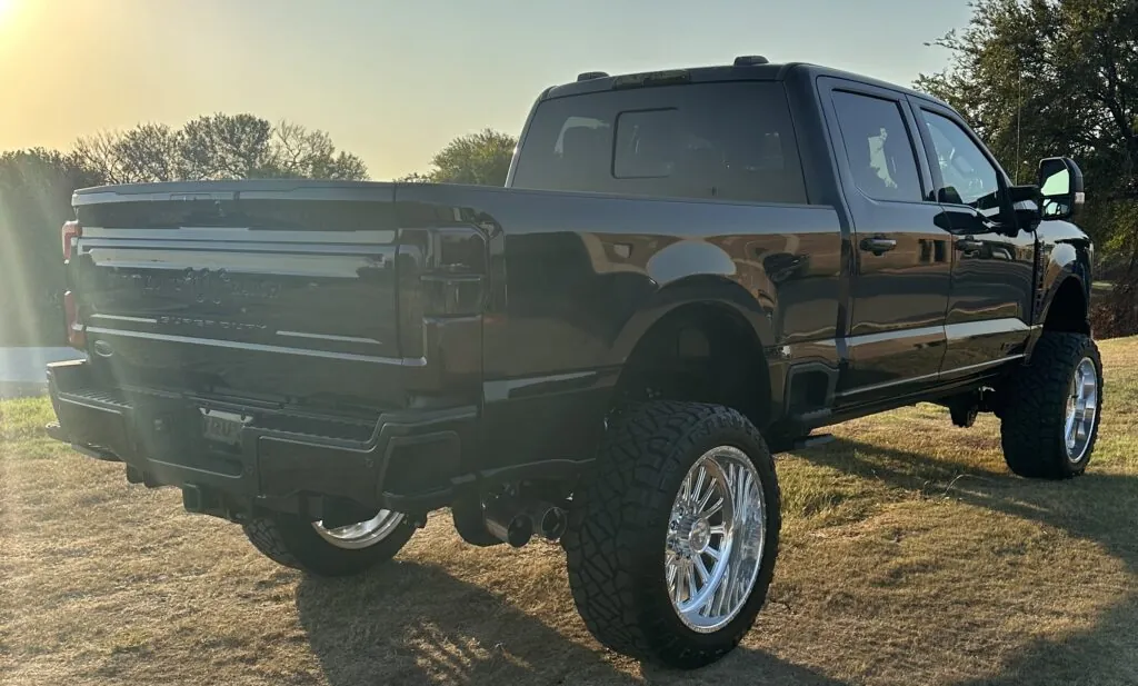 The Retrax IX power retractable tonneau cover and Truxx spray-in bed liner add practicality to this 2024 Ford F-250 Super Duty King Ranch