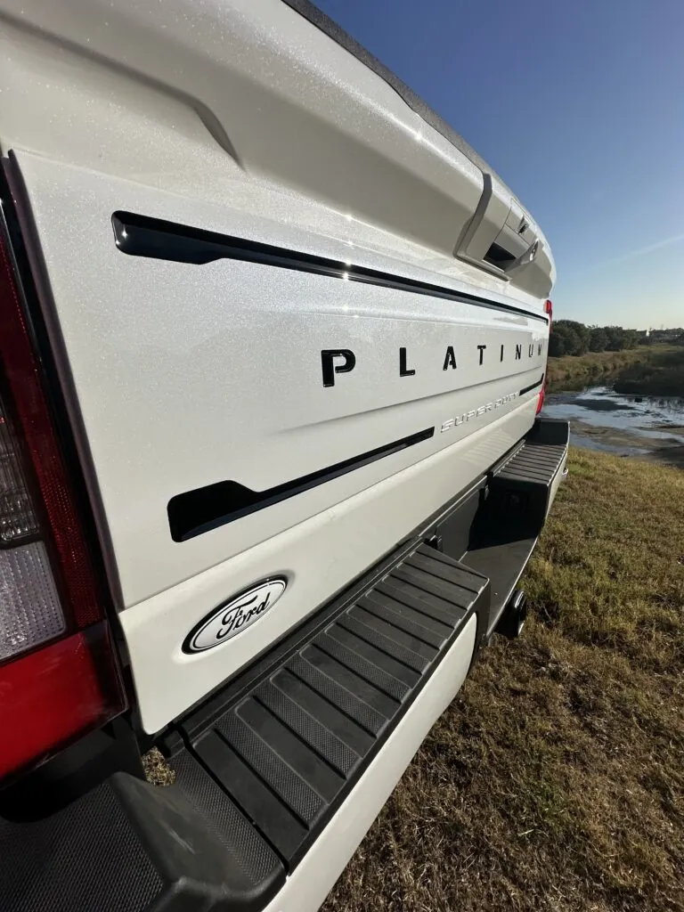 A full chrome delete and custom paint match to Ford Tricoat White Pearl
