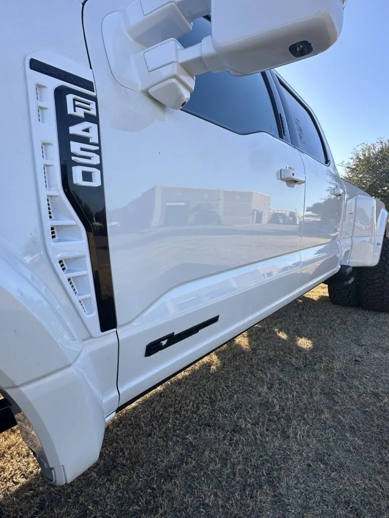 A full chrome delete and custom paint match to Ford Tricoat White Pearl.