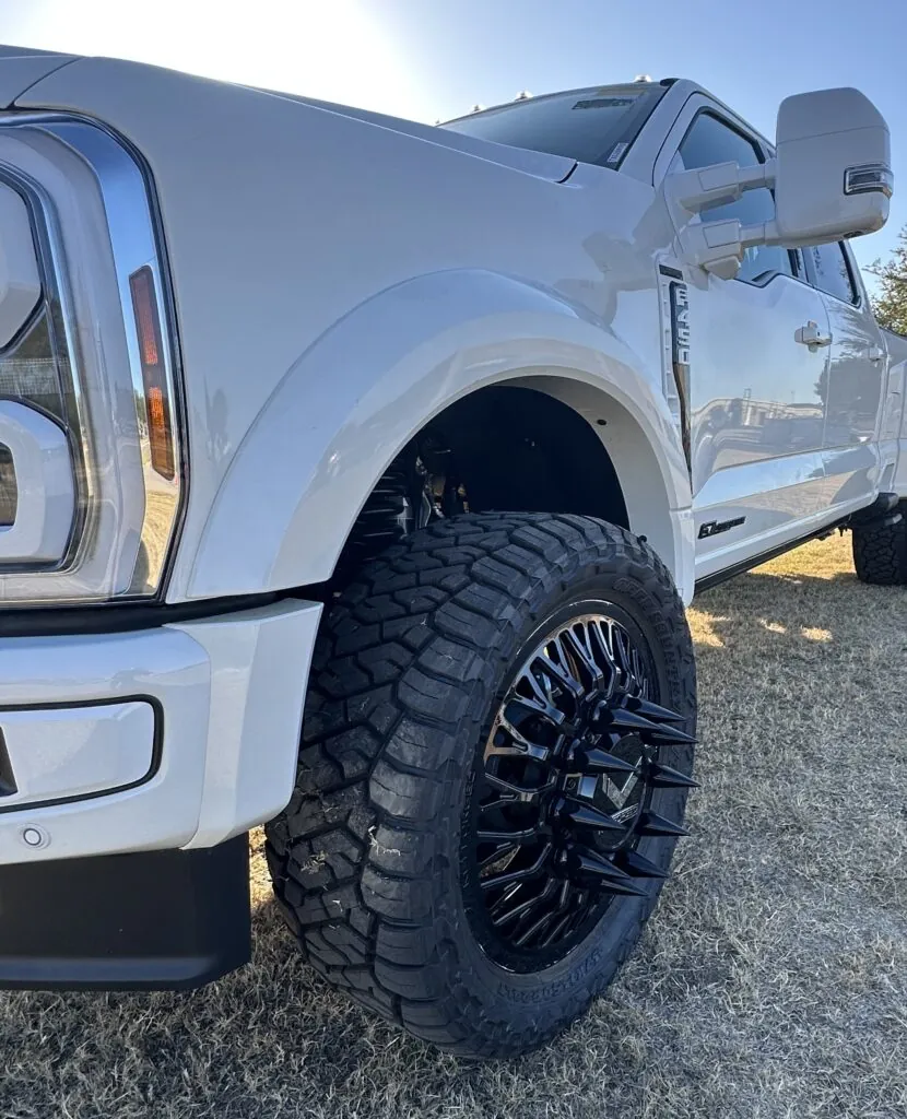4” Icon Suspension Lift, 24” Black KG-1 Forged Dually Wheels with Death Spike Lugs, and rugged 37/13.50/24 Toyo Open Country RT Tires