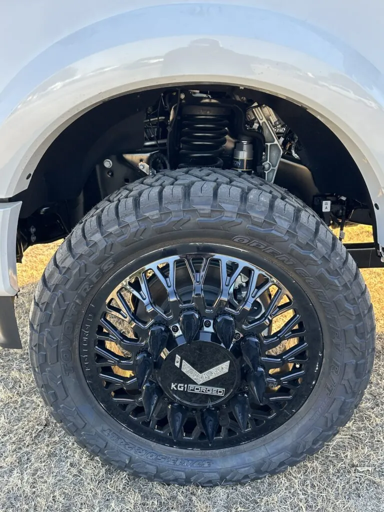 4” Icon Suspension Lift, 24” Black KG-1 Forged Dually Wheels with Death Spike Lugs, and rugged 37/13.50/24 Toyo Open Country RT Tires
